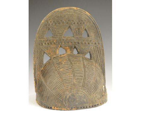 Tribal Art - a Yoruba/Benin helmet, pierced and carved with geometric motifs, 26cm high, Nigeria