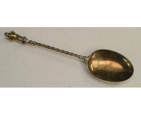 A mid-Victorian parcel-gilt silver 'Apostle' table spoon, the figural finial cast as a rotund gentleman, 21.5cm long, London 