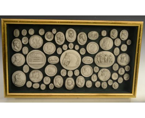 An arrangemrent of Grand Tour style plaster intaglio impressions, various Classical and Medieval subjects, 24.5cm x 43.5cm 