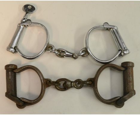 Crime and Punishment - a pair of Haitt Best cast steel handcuffs, numbered 339, mid-20th century; another pair of handcuffs, 