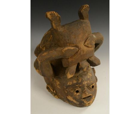 Tribal Art - a Yoruba Gelede helmet mask, 33.5cm high, Nigeria