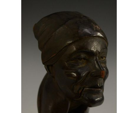 A Black Forest lever-action novelty nut cracker, carved as the head of a lady in a headscarf, 20cm long, c.1900