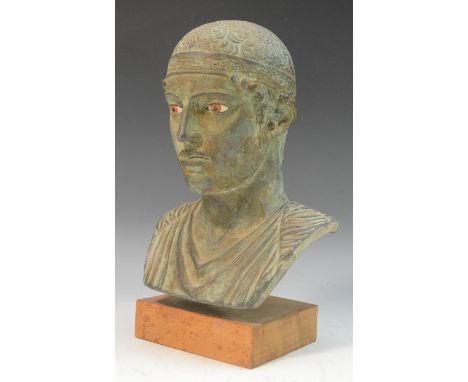 A museum type verdigris patinated composition bust, after the Ancient Greek, mounted for display, 27cm high