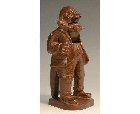 A Black Forest table top lever-action novelty nut cracker, carved as a bearded man, 15cm high