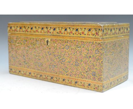A Kashmiri rectangular tea caddy, decorated overall in the Indo-Persian taste with dense scrolling flowers, hinged cover encl