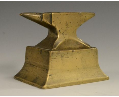 A brass jeweller's bench anvil, integral spreading rectangular base, 8cm wide