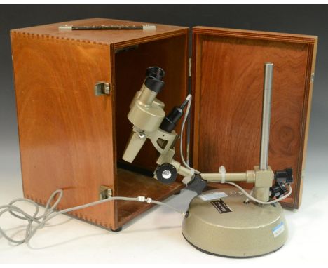 A Prior long arm stereo microscope, x200 magnification, adjustable axis, circular weighted base, 33.5cm high, cased