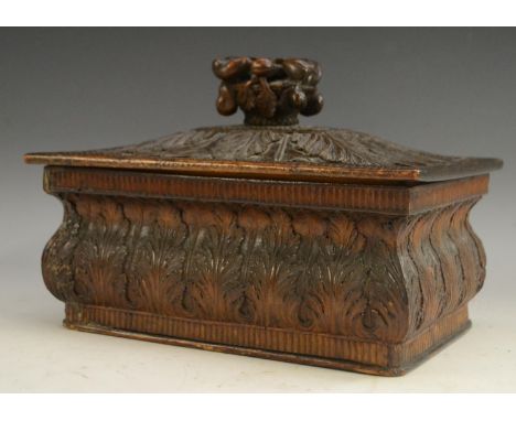 A Black Forest box and cover, fruiting branch finial, carved overall with stiff leaves and acanthus, 22cm wide, c.1840