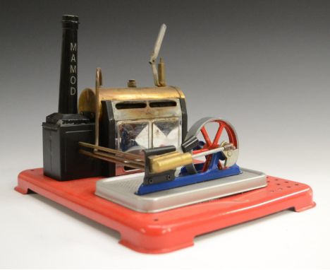A Mamod steam station, with boiler, chimney stack and flywheel driven stationery engine, on original base, 26.5cm wide