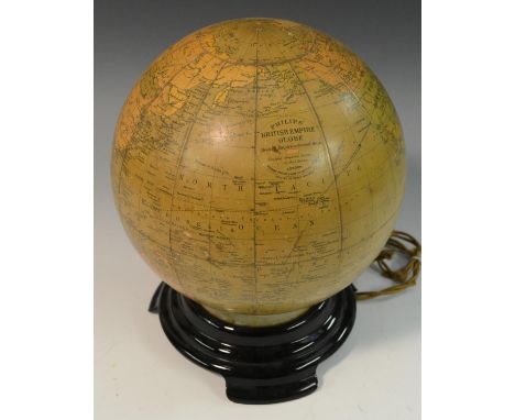 Cartography - an illuminated Phillips' British Empire Globe, the glass lamp applied with paper gores, 25cm high overall 