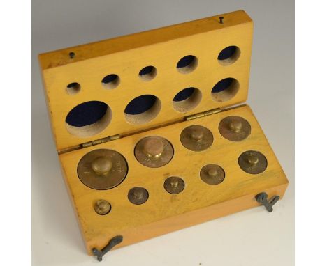 A set of brass scientific scale weights, from 100 to 1g, fitted beech case, 13.5cm wide overall