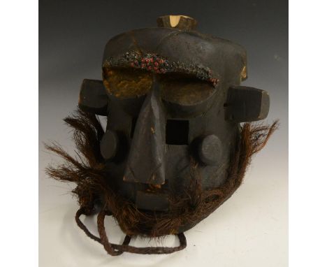 Tribal Art - a Kuba/Kete helmet mask, highly stylised geometric features, the pronounced forehead adorned with beads, the low