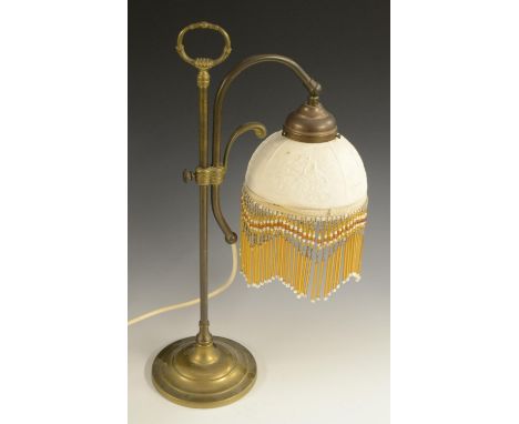 A brass adjustable reading lamp, lithophane shade, lotus-grasped posted loop handle, circular base, 47cm high, the shade earl