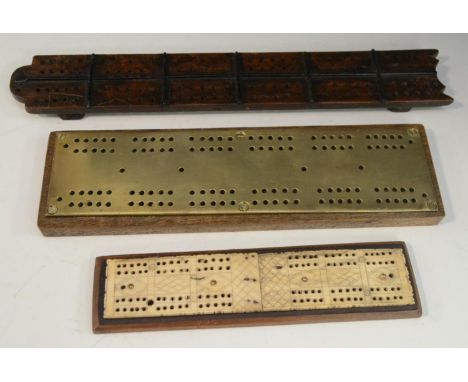 A 19th century bone 'Prisoner of War' cribbage board, wooden base, 20.5cm long; others, (3) 