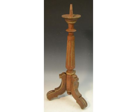 A 19th century parcel gilt pricket candlestick, fluted pillar, shaped tripod base, 54cm high