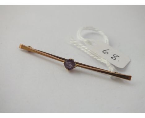 An amethyst set bar brooch in 9 ct 