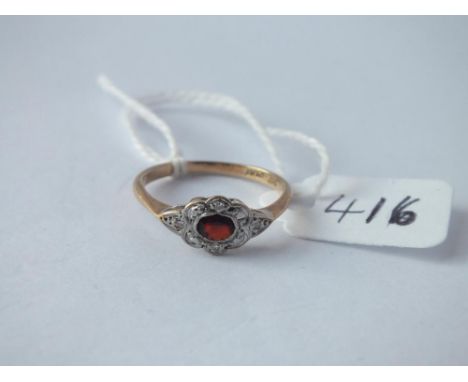 An Art Deco ruby and diamond ring in 9 ct and platinum - Size N - 1.8gms