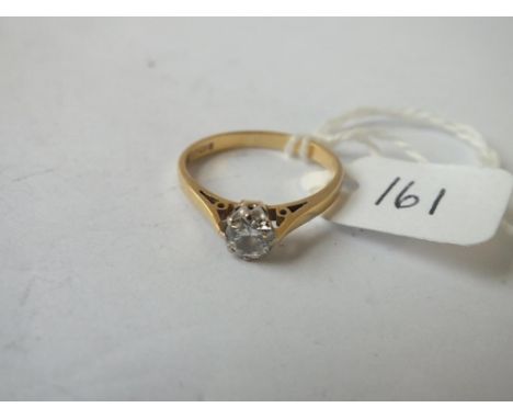 A SOLITAIRE DIAMOND RING set in 18 ct GOLD (approx. half carat) - Size M - 2.5gms.