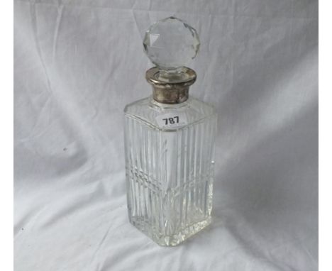 A square mounted decanter and stopper with cut glass body - London