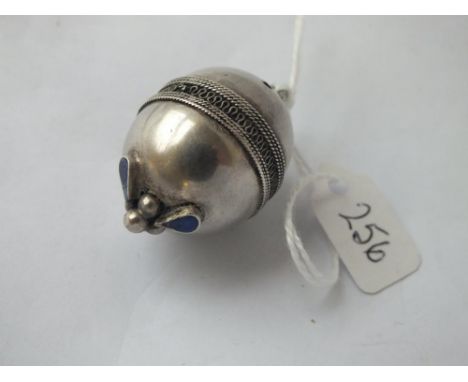 An antique silver pendant in the form of an egg with blue enamel
