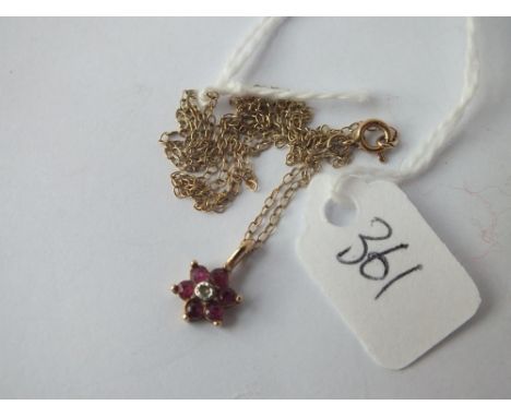 9ct ruby flower pendant on 9ct chain 1.3g inc