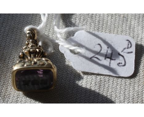 A heavy cased seal with cased decorations set with an amethyst - 5.2gms