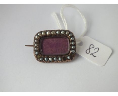 An antique rectangular pearl set mourning brooch 