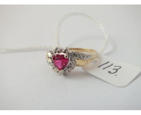 A ruby and diamond heart shaped ring in 9 ct - 2.6gms.