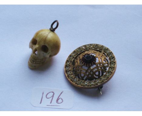 Attractive paste set brooch and a small carved skull charm &nbsp;&nbsp;&nbsp;&nbsp; 