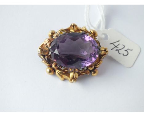 Large amethyst stone set brooch in fancy gold mount