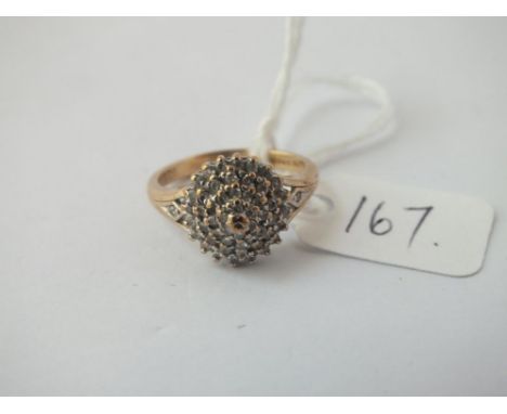 A diamond cluster ring in 9 ct - Size K - 3gms.
