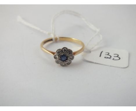 A sapphire and diamond cluster ring in 18 ct gold - Size P - 2.3gms.