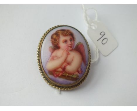 A vintage porcelain brooch of a winged cherub 