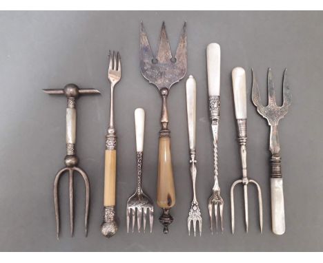 A variety of silver plated bread and pickle forks with mother of pearl handles etc. 