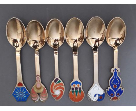 A set of six Danish silver gilt and enamel year spoons each with a different enamelled design and date, marked 'A Michelsen S