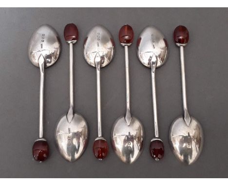 A set of six silver bean spoons with amber finials, William Hair Haseler, Birmingham 1925, gross wt. 43g. 