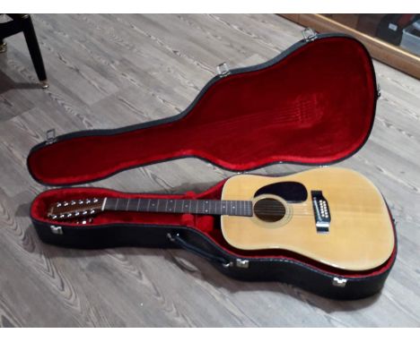 A Fender 12 string acoustic guitar, model F-55-12, S No F 705 7/6, in hard case. 