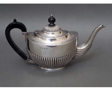 A silver tea pot with ebonised wood handle and finial, Joseph Gloster Ltd, Birmingham 1902, gross wt. 14.7ozt. 
