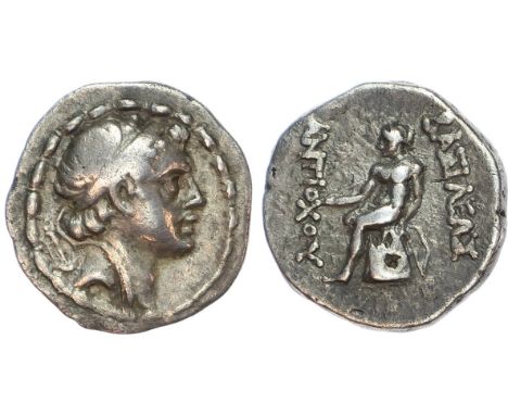 Diademed head right. Rev. Apollo seated left on omphalos, holding bow and arrow. (SC 1543). Good Very Fine.