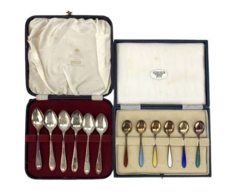 Cased set of six silver gilt coffee spoons, each with a coloured enamel stem together with a cased set of six silver teaspoon