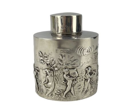 Edwardian silver tea caddy of oval form embossed with a procession of musicians, buildings etc H9.5cm Chester 1901 Maker Geor