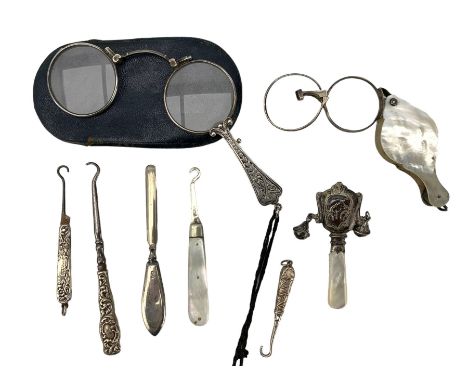 Pair of Continental silver lorgnettes stamped 900 with leather pouch, silver button hooks, pair of mother of pearl folding sp