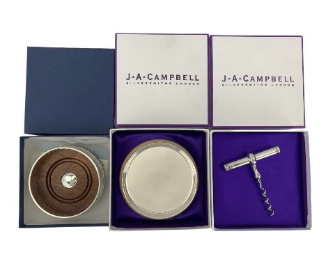 Set of six silver coasters on a wooden stand, boxed, silver corkscrew and a silver coaster with wooden base London 1904-7 wit