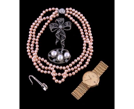 A cultured pearl and marcasite brooch/pendant, of foliate design set with three cultured pearls within marcasite set surround