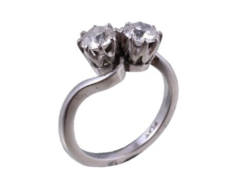 A diamond crossover ring, the two old brilliant cut diamonds estimated to weigh 1.00 carat total, in eight claw settings, sta