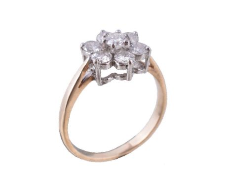 A diamond cluster ring, set with brilliant cut diamonds, approximately 0.75 carats total, in claw settings, stamped 375, fing