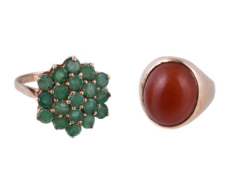 A carnelian ring, the oval cabochon carnelian in a collet mount, stamped 375, finger size H; and an emerald cluster ring, set