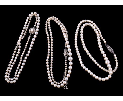 A cultured pearl necklace, the single strand of cultured pearls, measuring 3mm to 7mm, to a paste set clasp, 45cm long; and t