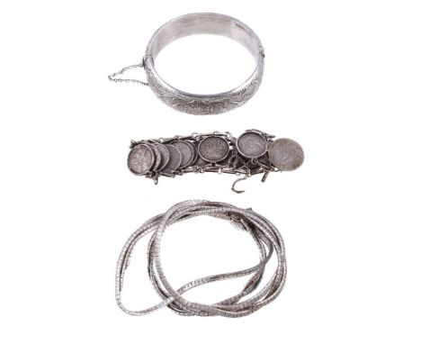 A 1960s silver bangle, Birmingham 1962, the hinged silver bracelet with foliate decoration throughout, to the concealed clasp