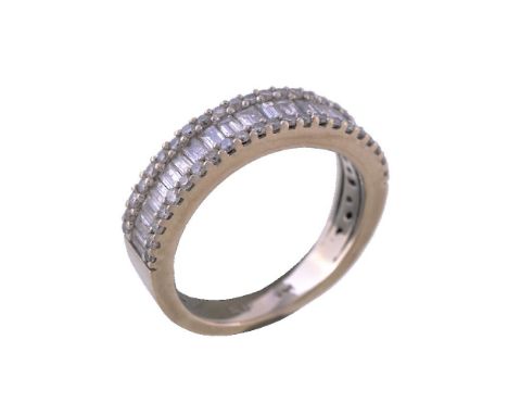 A diamond half eternity ring, the baguette cut diamonds set between two rows of brilliant cut diamonds, approximately 0.95 ca